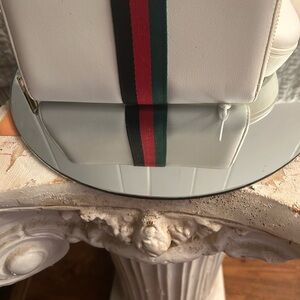White Backpack with Red and Green Stripe